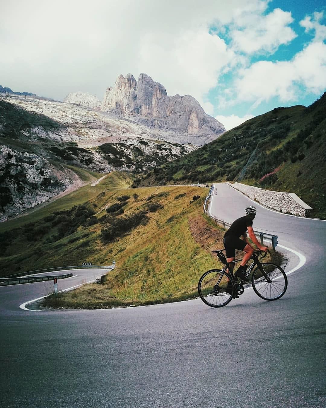 Cyclist analyzing map and planning tour